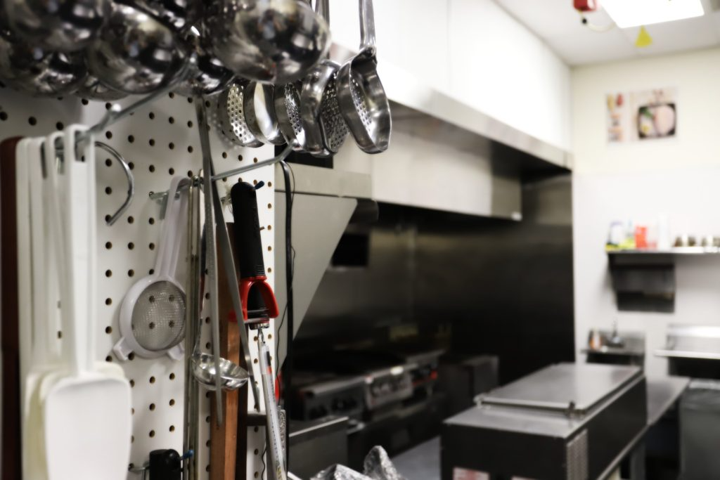 Utensils and cooking line inside the NICCLLC culinary center